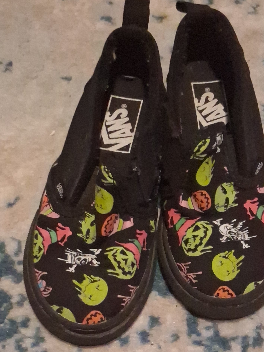Vans Kids Slip-On Shoes in Black with Neon Pumpkin Print